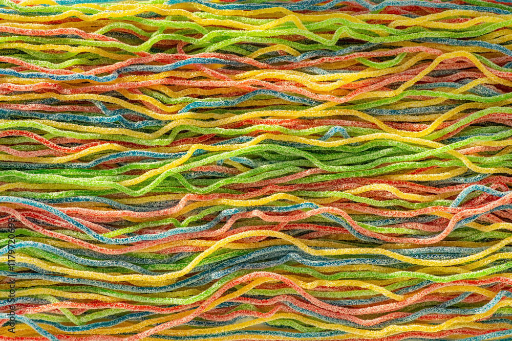 Multicolored candied spaghetti gummies, top view Multicolored candied spaghetti gummies, top view