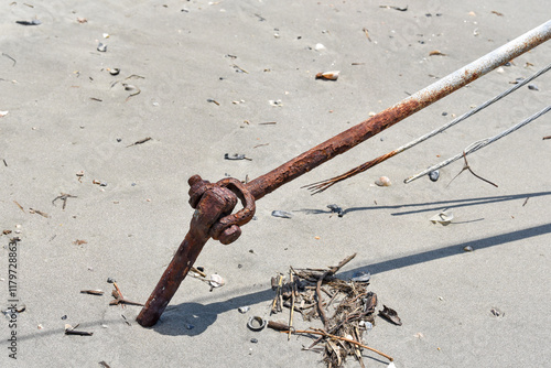 Rusty Utility Anchor on Beach