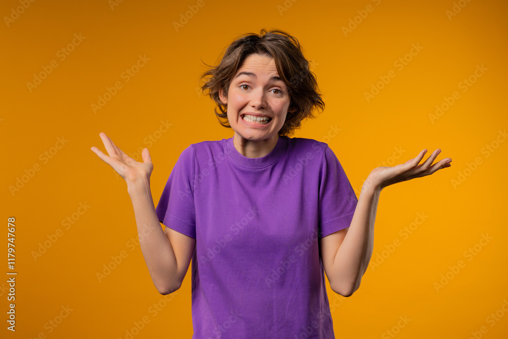 Confused pretty woman, shoulders up - can't help, makes gesture of I dont know. Difficult question, guilty reaction, puzzled stylish lady on yellow background Confused pretty woman, shoulders up - can't help, makes gesture of I dont know. Difficult question, guilty reaction, puzzled stylish lady on yellow background