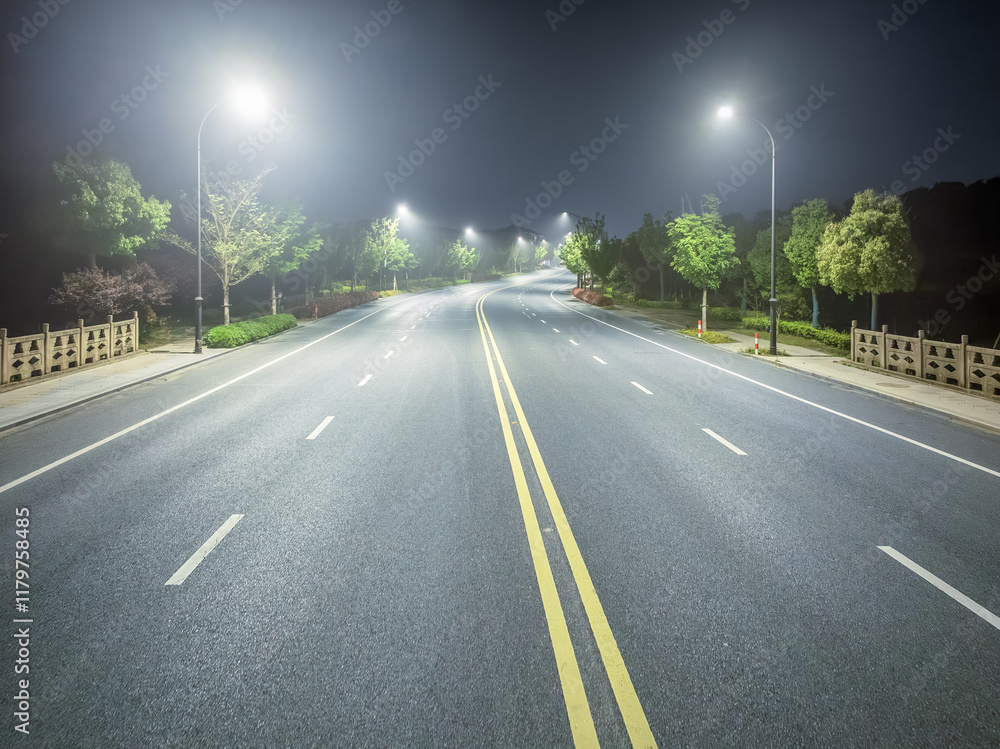 Empty highway at night illuminated by street lights with a calming scene. Empty highway at night illuminated by street lights with a calming scene.