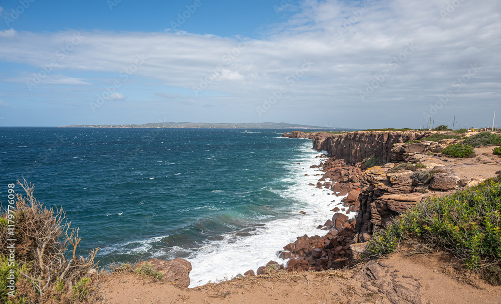 The beautiful high red cliffs of Macorì on the island of Sant'Antioco in Sardinia