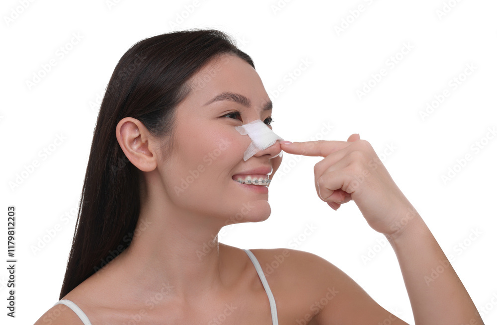 Woman with medical bandage on her nose after plastic surgery operation against white background Woman with medical bandage on her nose after plastic surgery operation against white background