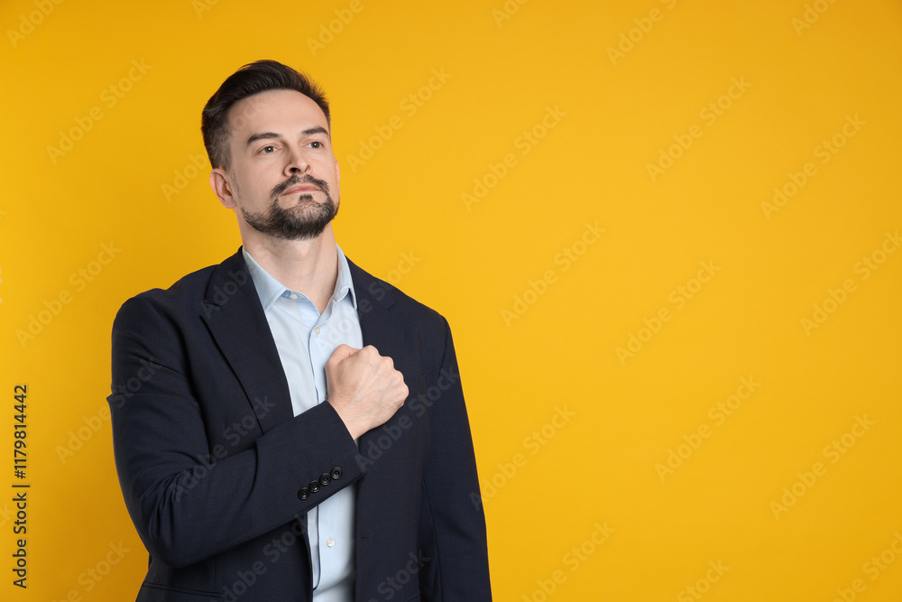 Man making promise on orange background, space for text. Oath gesture Man making promise on orange background, space for text. Oath gesture