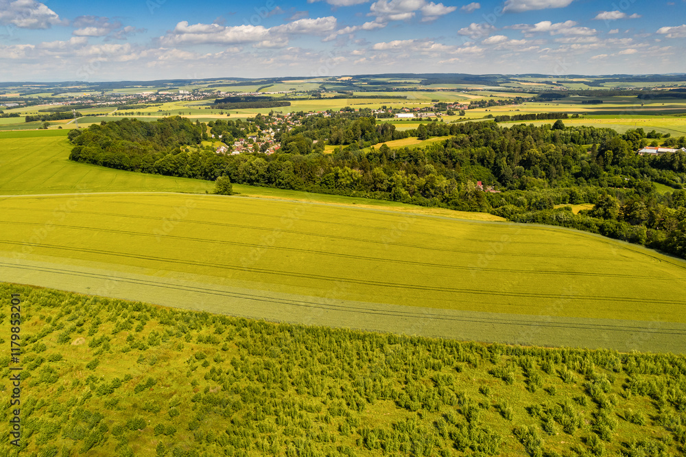 Fototapeta premium Aerial view of ex Sudeten village Vendoli on historical border Moravia and Czechia in June 2022