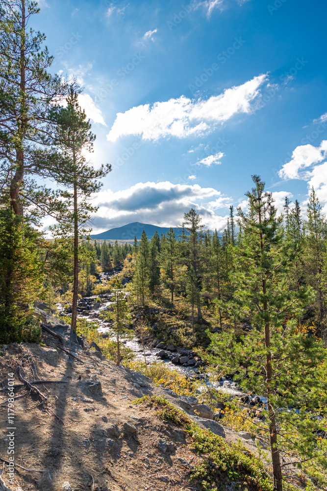Chasnayok creek in Khibiny mountains near Chorrgor south pass. Early autumn in arctic tundra region. Kola peninsula, Murmansk region, Russia.