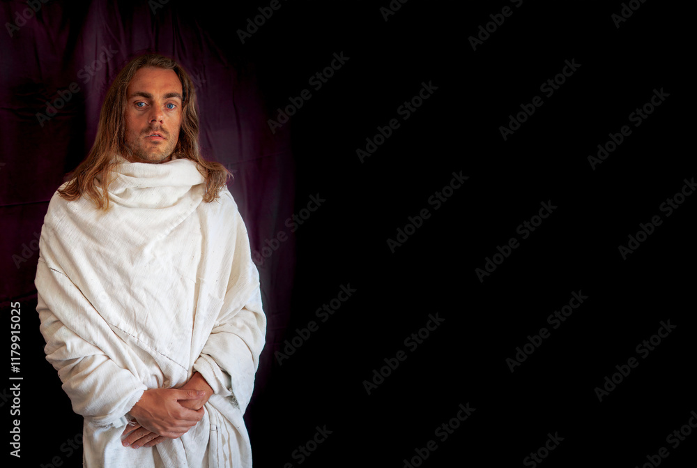 A long-haired man in a white robe resembling Jesus