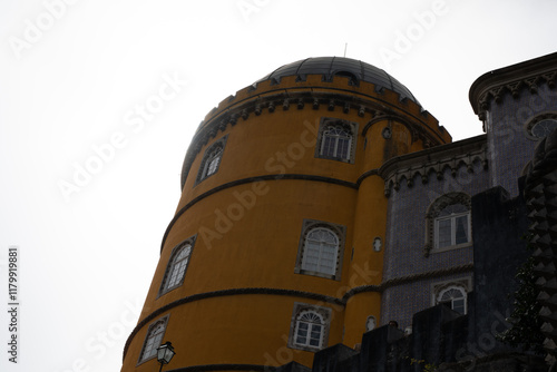A yellow tower of a fairyta...
