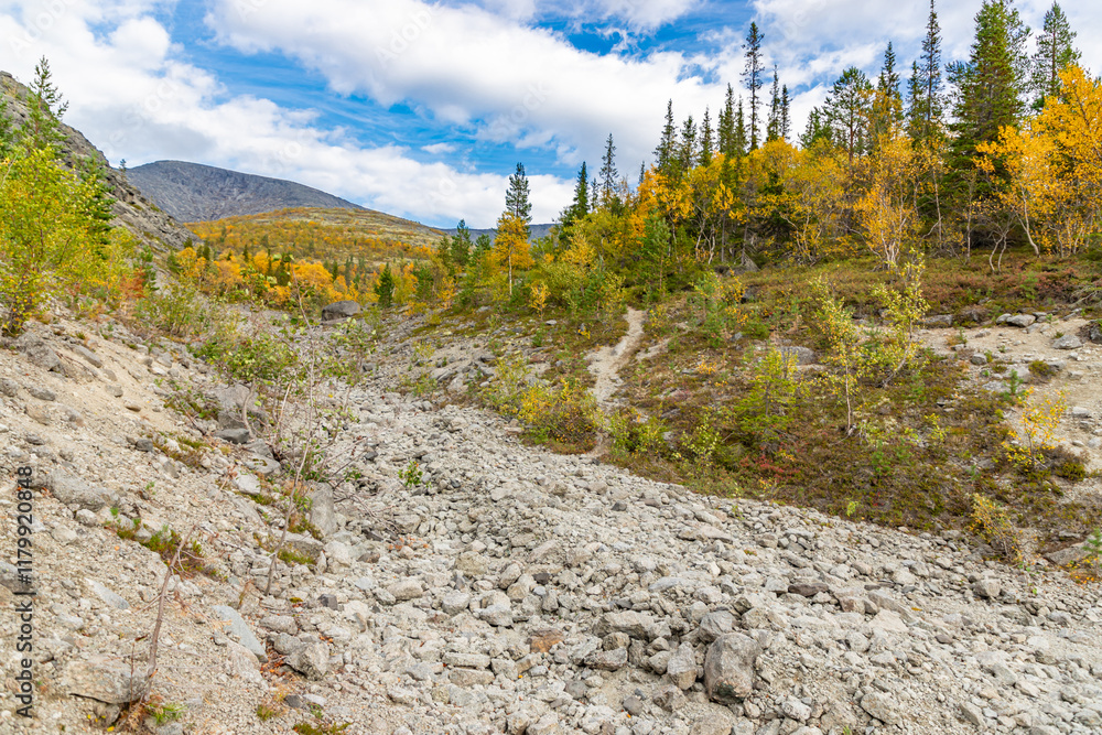 View to Khibiny mountains near Mannepakhp river. Early autumn in arctic tundra region. Kola peninsula, Murmansk region, Russia.