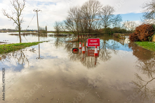 Severe flooding on the B1223 road between the rural villages of Ryther and Cawood near Selby in North Yorkshire with water from the River Wharfe spilling over into agricultural fields.  Copy space