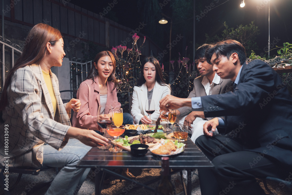 Nighttime Gathering: Friends enjoying a delightful meal together, sharing laughter and conversation under the soft glow of outdoor lights. Nighttime Gathering: Friends enjoying a delightful meal together, sharing laughter and conversation under the soft glow of outdoor lights.