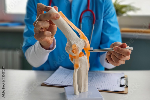 Konstfotografi Doctor shows anatomy of structure of human knee joint concept