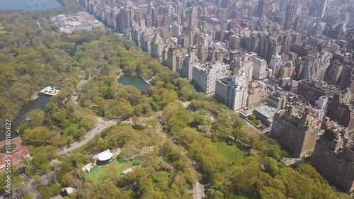 NEW YORK, USA - JANUARY 5, 2025: Aerial view of Central Park showcasing greenery and city skyline during winter season