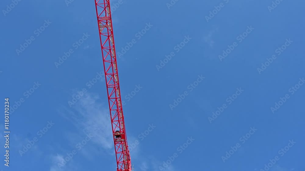 The construction industry. Red crane on a building site. The construction industry. Red crane on a building site.