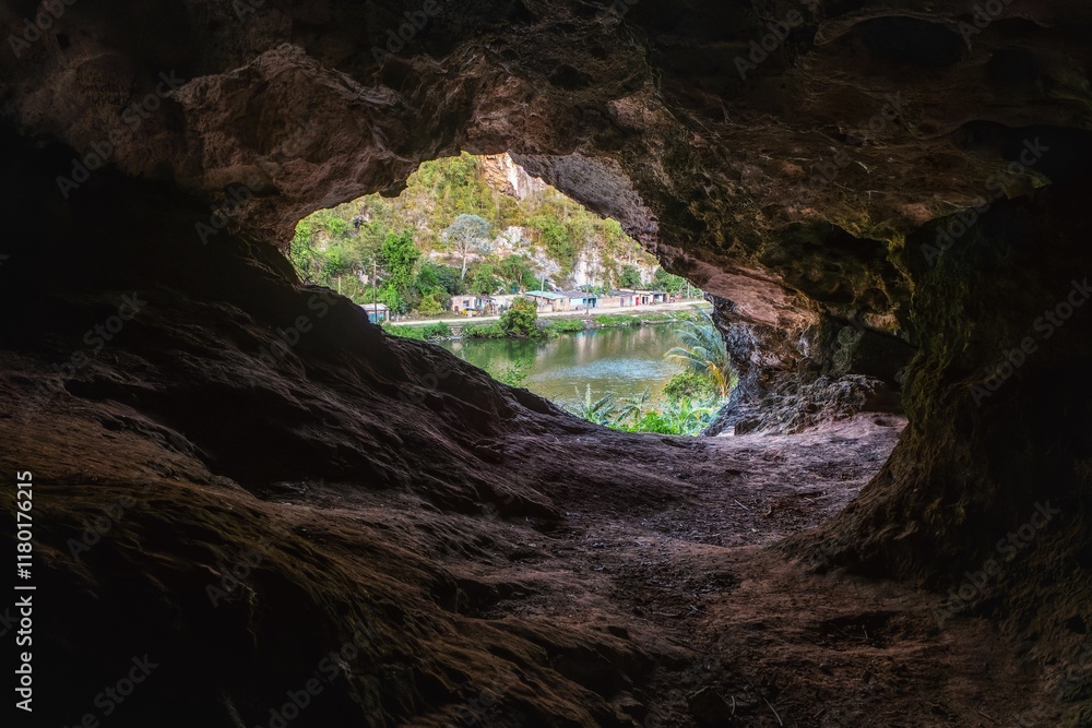 Cave view with lush river landscape. Cave view with lush river landscape.