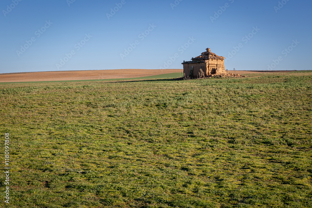 Fototapeta premium Tierra de Campos region and old ruined dovecote. Cerecinos de Campos, Zamora, Castile and Leon, Spain.