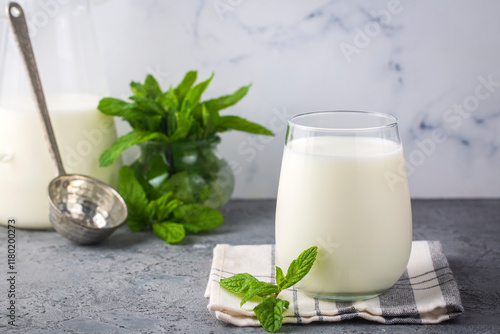 Obraz na płótnie Glass cup of Turkish traditional drink ayran , kefir or buttermilk made from yogurt, healthy food w salonie