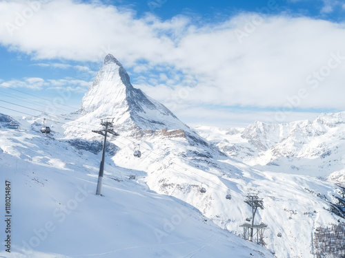 Matterhorn, Switzerland. Winter mountain landscape. A place for skiing. Zermatt ski resort. High rocks and snow. Mountain scene in Switzerland. Photo for postcards, backgrounds, wallpapers.