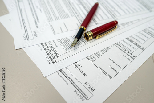 PIT-11 polish tax form on accountant table with pen close up. Tax time photo