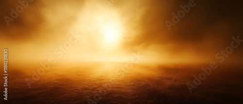 Golden sunset over foggy landscape.