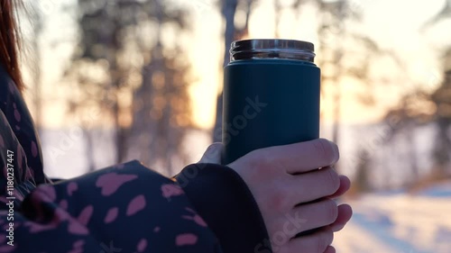 Hot Thermos in Winter Girl Hands