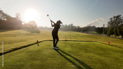 Obraz na płótnie Woman playing golf on beautiful course , swinging and hitting golf ball , luxury vacation w salonie