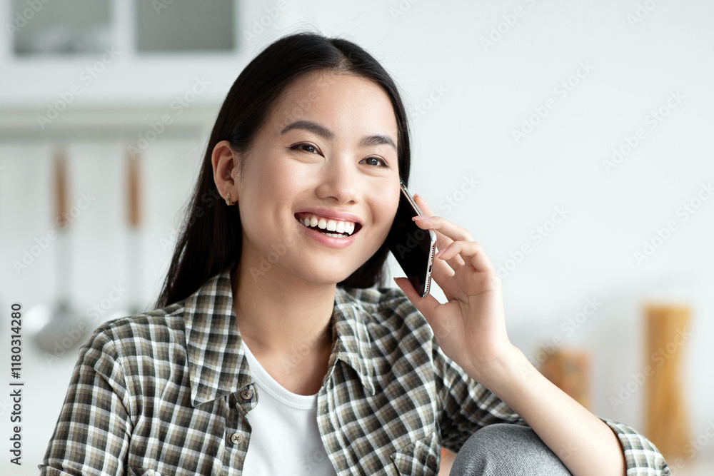 Young asian lady having healthy breakfast and talking on phone, smiling and looking at copy space. Cheerful woman sitting at kitchen, eating oatmeal and chatting with girlfriend or lover Young asian lady having healthy breakfast and talking on phone, smiling and looking at copy space. Cheerful woman sitting at kitchen, eating oatmeal and chatting with girlfriend or lover