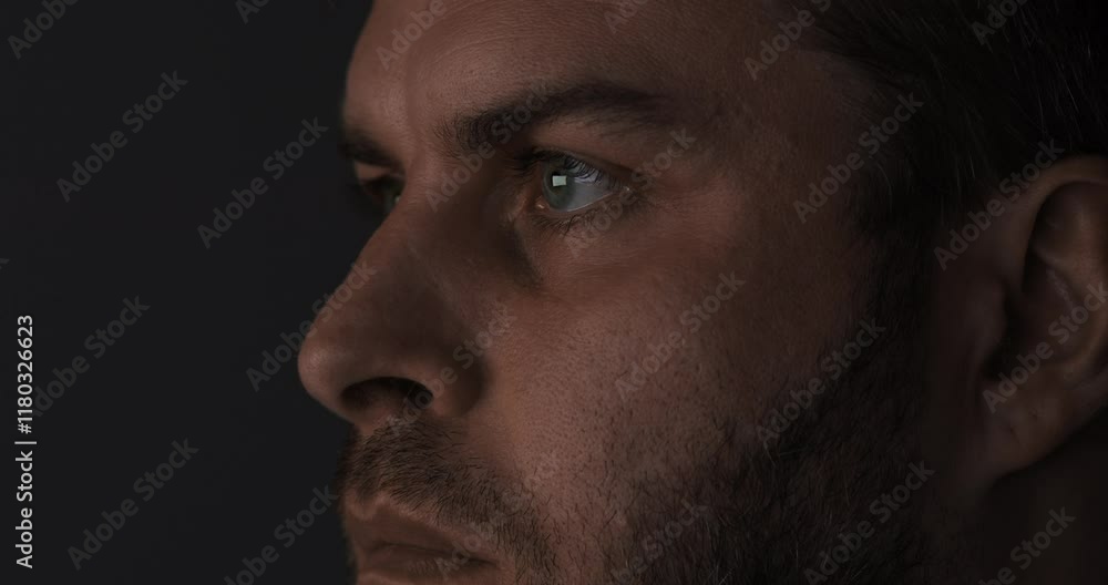 An Intense CloseUp of a Mans Profile Captured in Striking and Dramatic Lighting Effects An Intense CloseUp of a Mans Profile Captured in Striking and Dramatic Lighting Effects