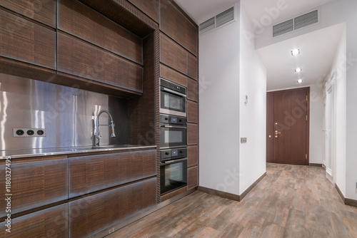 Wallpaper Mural The interior of a modern kitchen. Stylish design of the kitchen set made of dark wood. Built-in appliances, stylish accessories. Torontodigital.ca