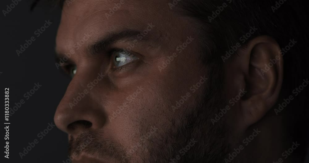 The Intense Gaze of a Man Set Against a Dark and Enigmatic Atmosphere that Captivates The Intense Gaze of a Man Set Against a Dark and Enigmatic Atmosphere that Captivates