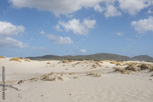 The beautiful beach of Is Solinas in Sardinia with its high white dunes on a windy day