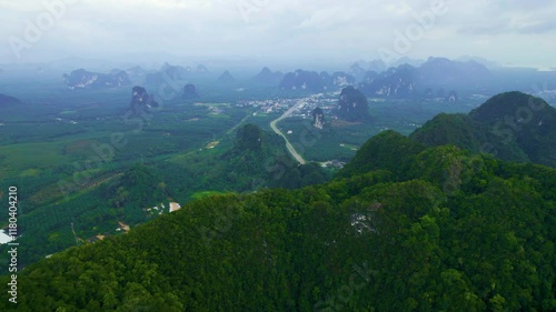 Krabi town and palm oil plantations seen from khao phanom bencha national park photo