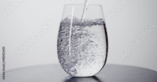 Adding Fresh Water To A Glass photo