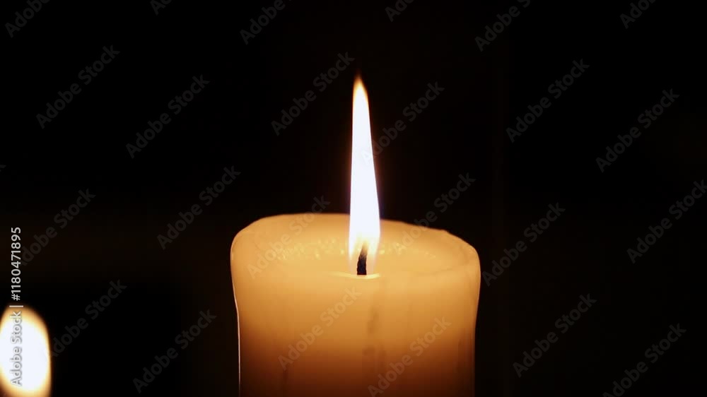 Closeup candle beautiful burning on dark black background with blur lights behind, candle fire flame light with empty space. Ritual with romantic candle wax fire
Closeup candle beautiful burning on dark black background with blur lights behind, candle fire flame light with empty space. Ritual with romantic candle wax fire