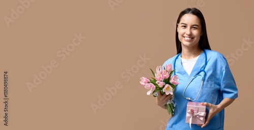 Female nurse holding tulips...