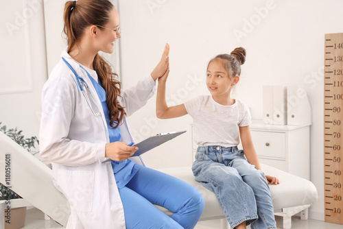Female pediatrician with li...