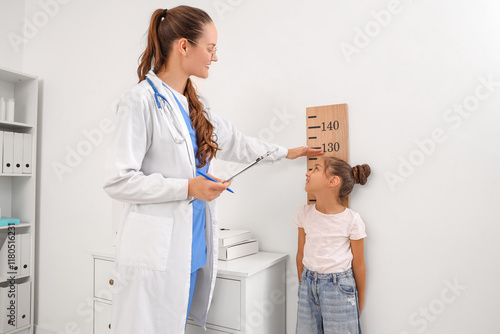 Female pediatrician with li...