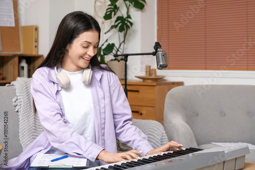 Smiling young woman playing...
