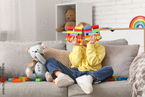 Young child playing with co...