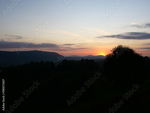 Wallpaper Mural Silhouette of mountain whith tree and blue sky at sunrise , Horizon began to turn orange with gold color in tropical areas, Thailand Torontodigital.ca