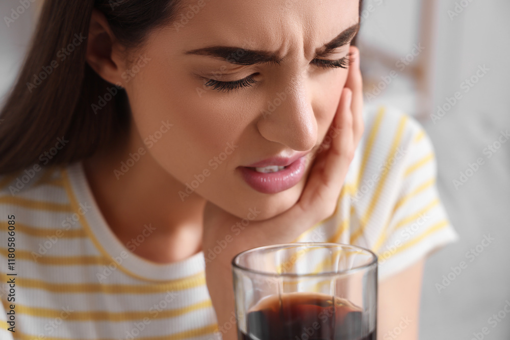 Young woman suffering from toothache with soda at home, closeup Young woman suffering from toothache with soda at home, closeup
