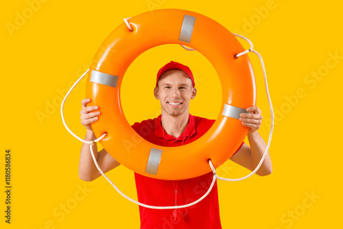 Male lifeguard with rescue ...