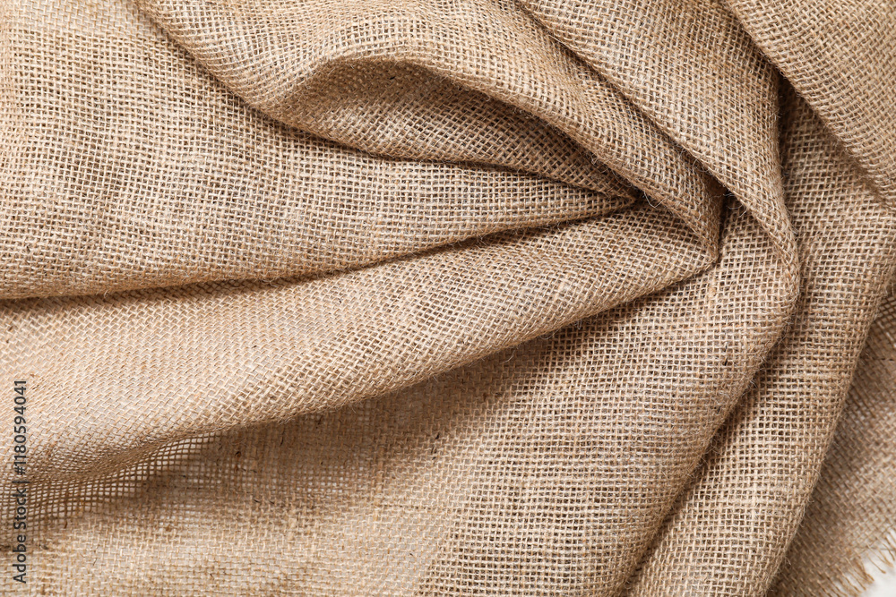 Fototapeta premium Burlap fabric with folds, closeup