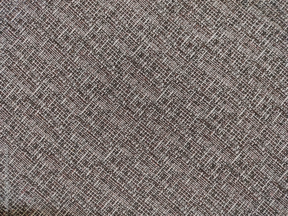 surface texture with a woven or knitted geometrical pattern. The pattern is seen to consist of small lines that cross each other to form a grid surface texture with a woven or knitted geometrical pattern. The pattern is seen to consist of small lines that cross each other to form a grid