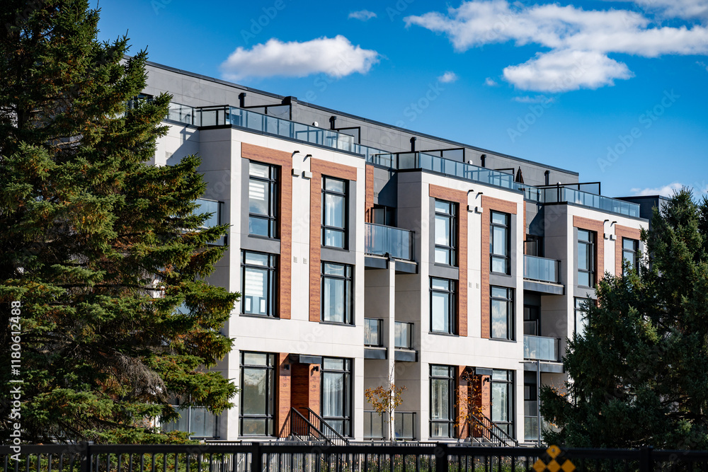 Exterior view of modern apartment building offering luxury units. Exterior view of modern apartment building offering luxury units.