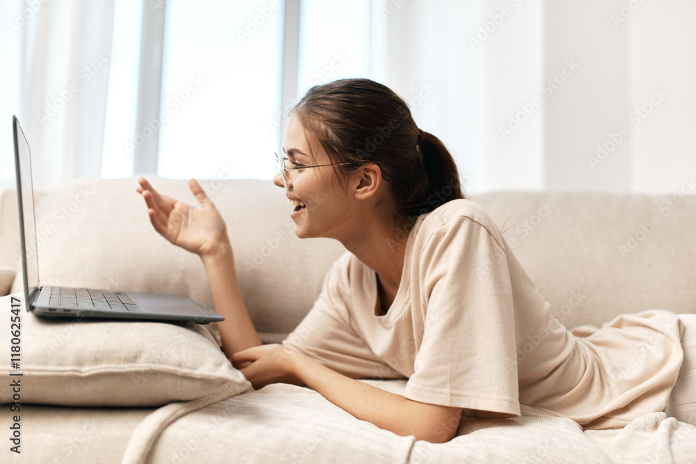 Smiling Woman Working on Laptop: Modern Lifestyle and Online Freelance. Smiling Woman Working on Laptop: Modern Lifestyle and Online Freelance.