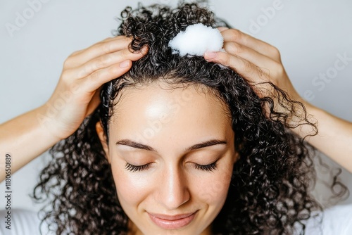 Transforming curly hair with the perfect mousse application.