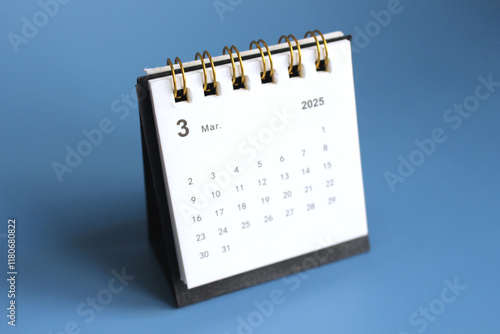 Monthly calendar template for the new year 2025 desk calendar,isolated on Blue background. photo