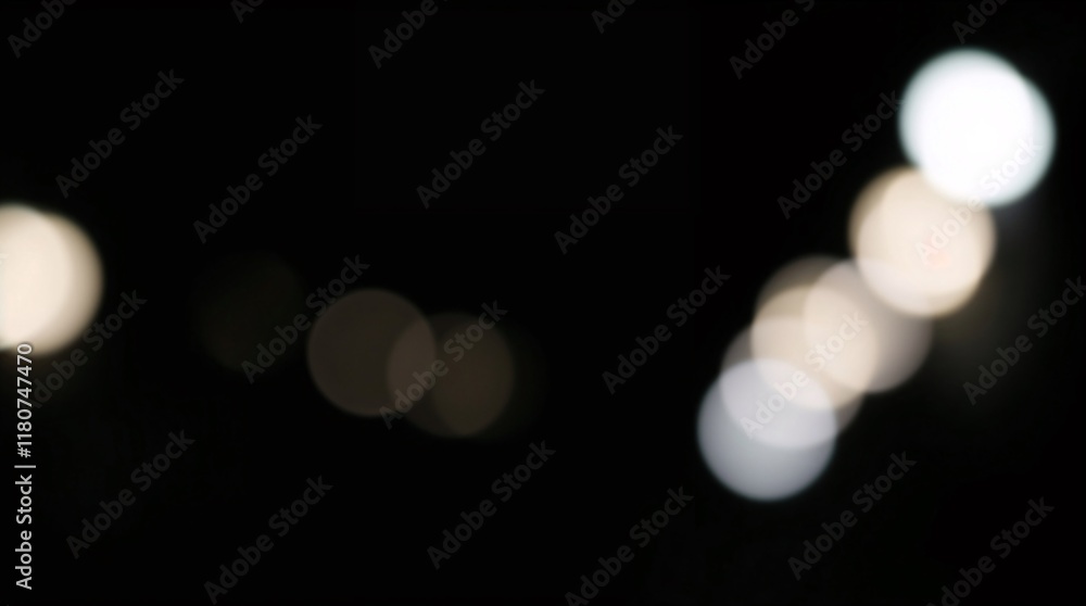 Fototapeta premium Blurred bokeh of various circle lights on a black background.