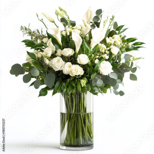 Elegant white flower arrangement in clear vase, featuring calla lilies, roses, and greenery, perfect for any occasion. This stunning bouquet brings touch of sophistication and freshness