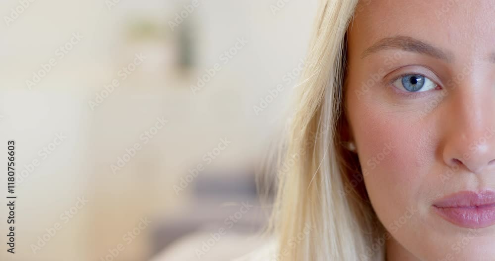 Close-up of woman with blue eyes and blonde hair, looking thoughtful at home, copy space Close-up of woman with blue eyes and blonde hair, looking thoughtful at home, copy space